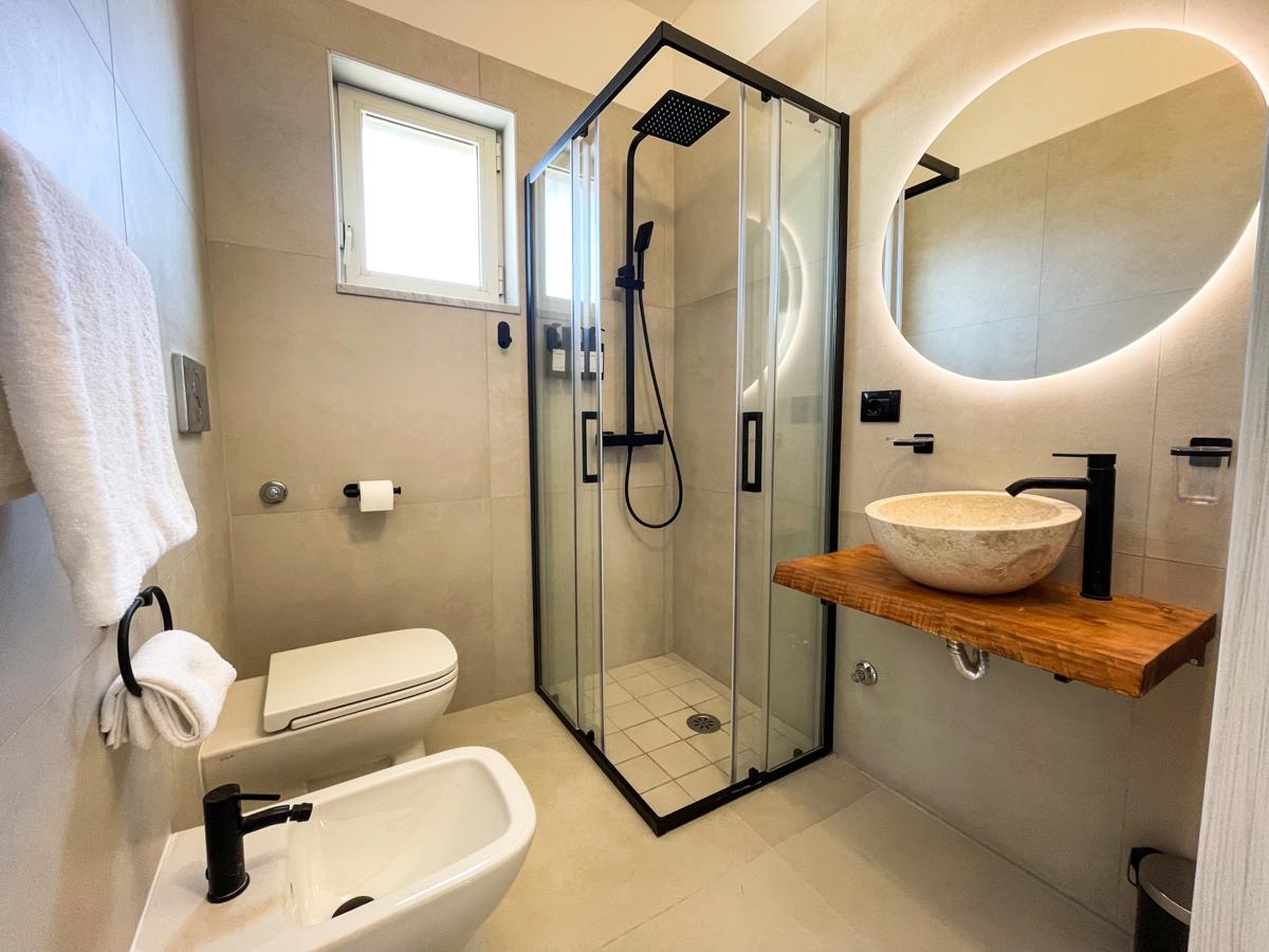 Modern bathroom interior at Terrazza Iside luxury penthouse, Pozzuoli, Italy